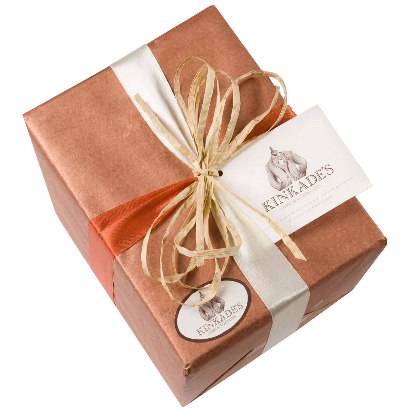 A wrapped Kinkade's Fine Clothing gift box with gold ribbon and brand seal